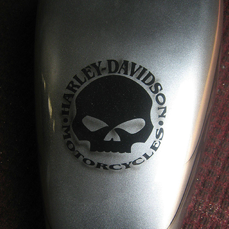 custom painted motorcycle with airbrushed harley logo