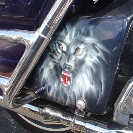 Custom painted harley bagger, ice pear with animal and people portraits, harley logo and flames