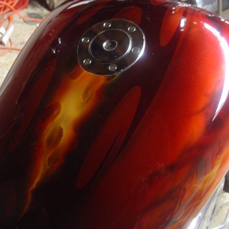 custom painted motorcycle with airbrushed tribal graphics  and realitic fire