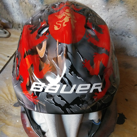 airbrushed goalie mask with lions and shield